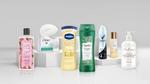 An assortment of Unilever brand products, including Dove soap, Love Beauty and Planet bodywash, and Suave shampoo.