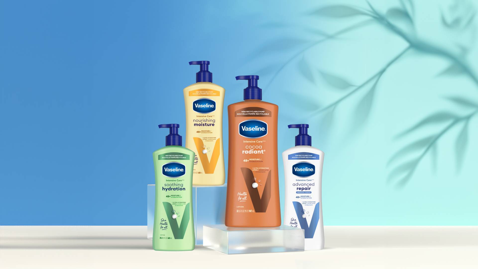 Four Vaseline Intensive Care lotions, including ‘Soothing Hydration’, ‘Nourishing Moisture’, ‘Cocoa Radiant’ and ‘Advanced Repair’. Each bottle is equipped with a recyclable pump dispenser. The products are arranged in front of a blue background, with a leaf motif.