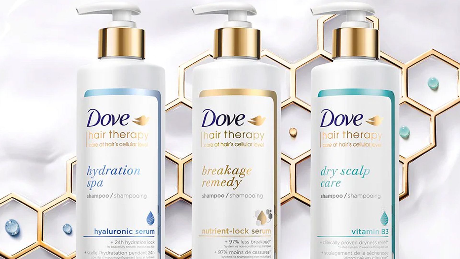 Advertising image showing four bottles in the new Dove Hair Therapy range.