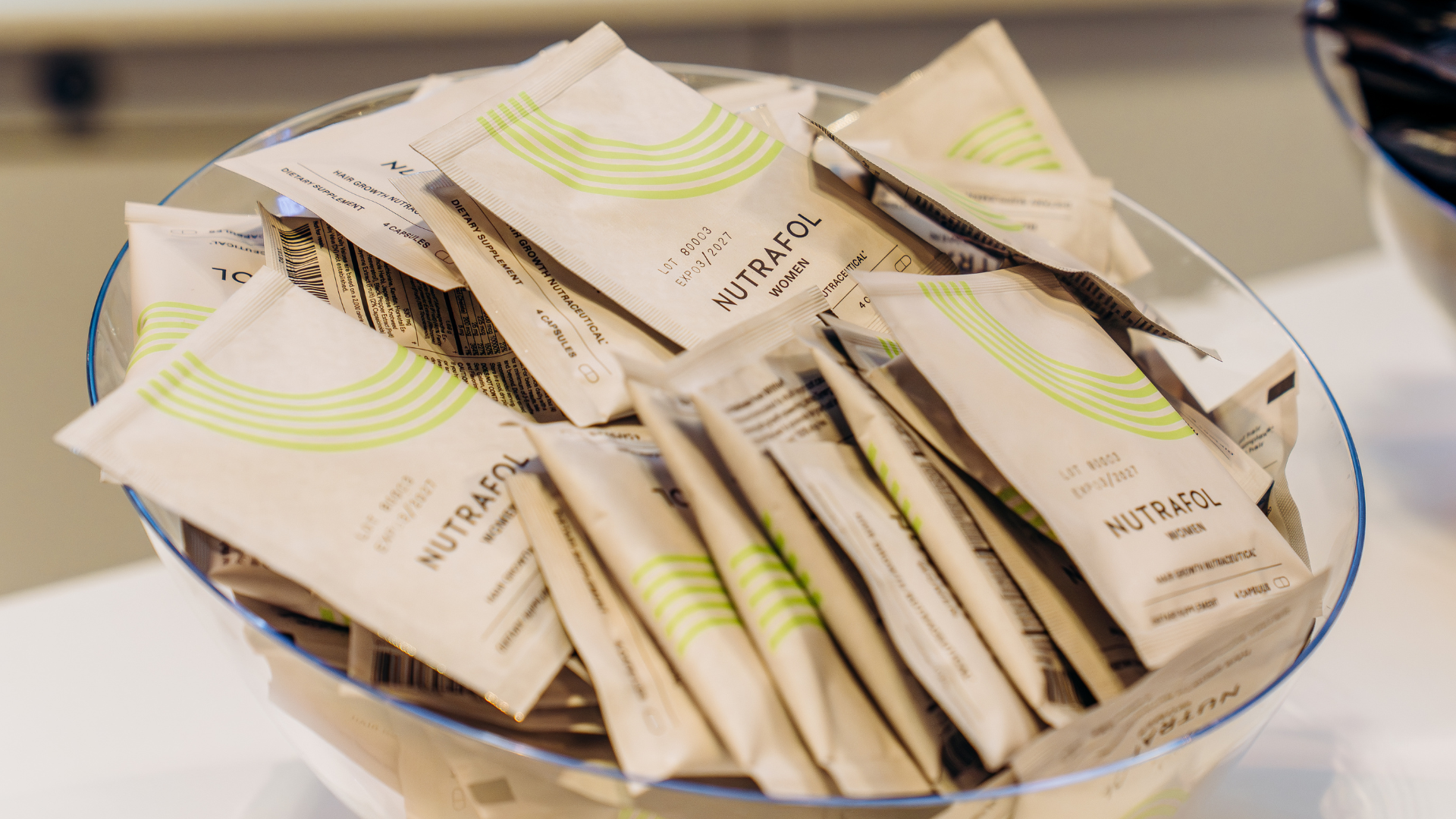 Bowl filled with Nutrafol products