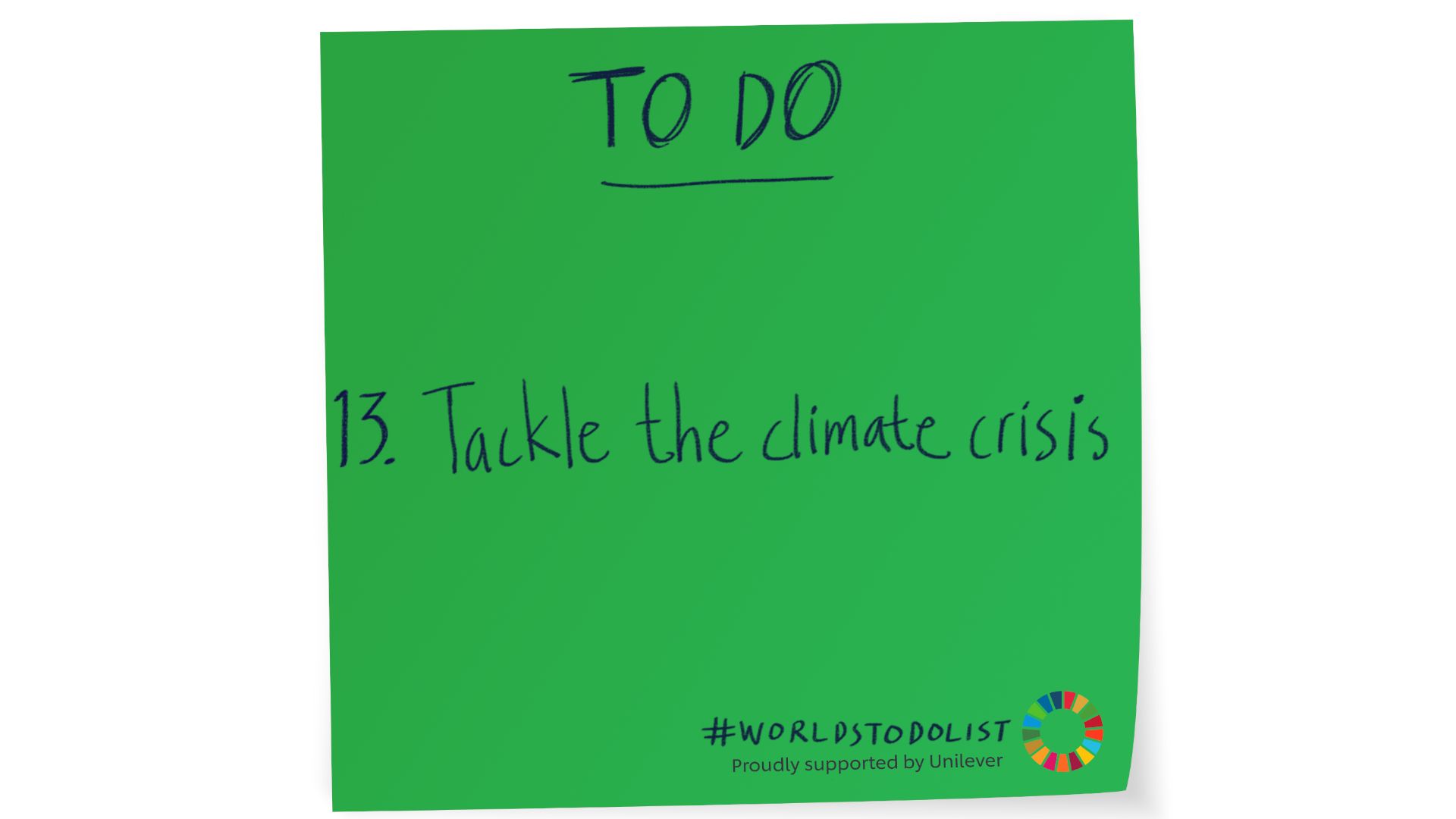 Green sticky note with Tackle the climate crisis written on it 