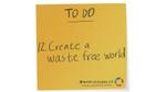 Mustard coloured sticky note with Create a waste free world written on it