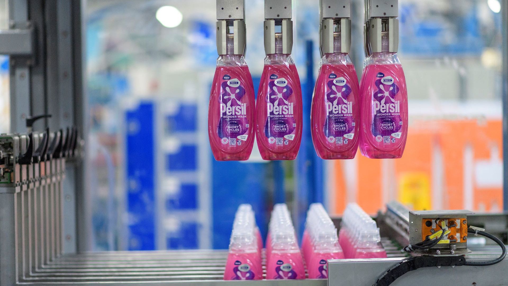 Persil Wonder Wash bottles in the manufacturing process.