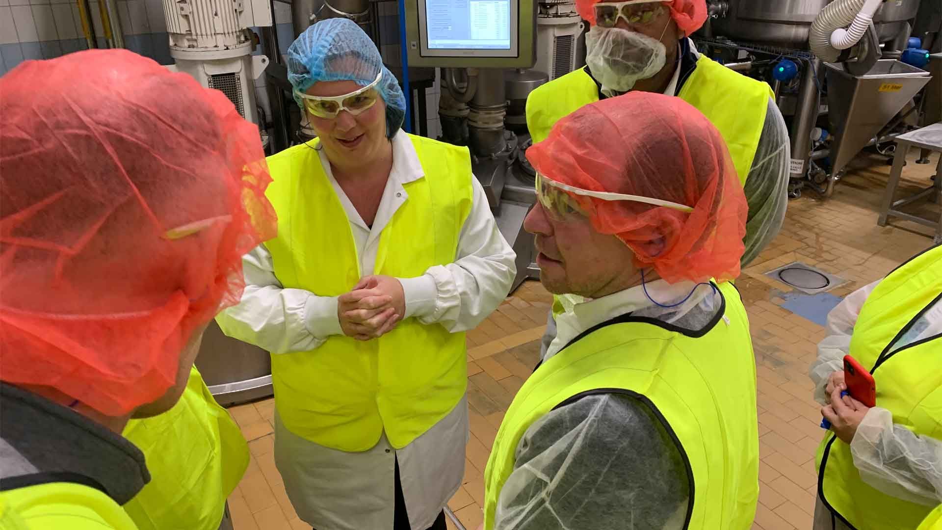 Matt Close visiting ice cream factory in safety gear